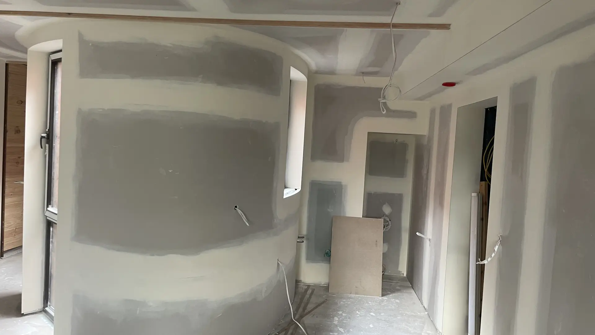 Plasterer finishing plasterboard installation in a new home in Seymour